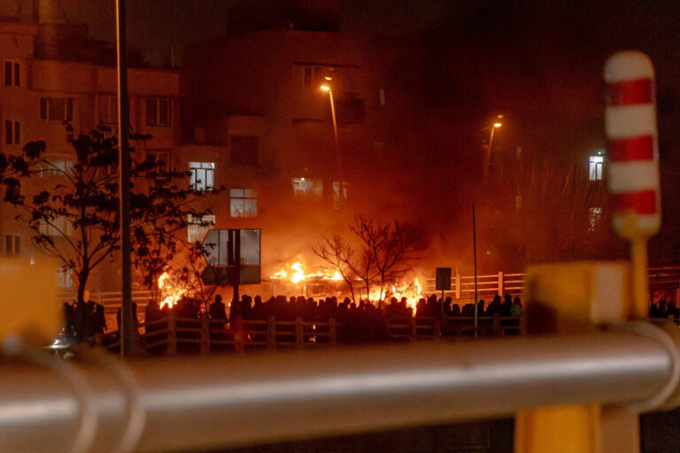 Iranians gather while blocking a street during a protest in Tehran, Iran on January 9, 2026. The nationwide protests started in Tehran's Grand Bazaar against the failing economic policies in late December, which spread to universities and other cities, and included economic slogans, to political and anti-government ones. (Photo by Khoshiran / Middle East Images / AFP via Getty Images)